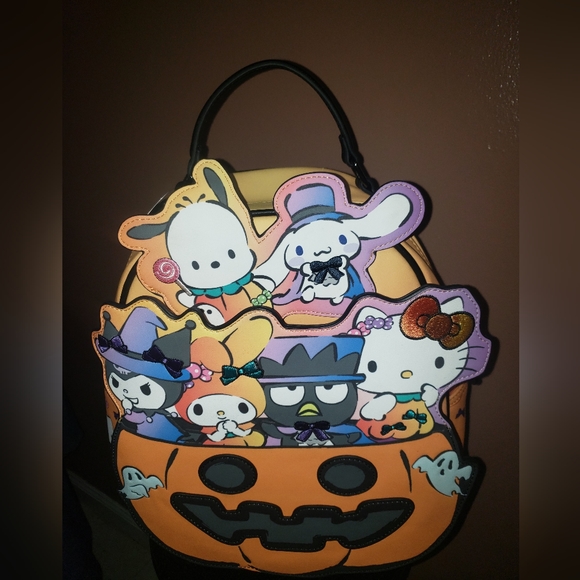 hello kitty backpack halloween Loungefly Sanrio Witch Cosplay Womens Double Strap Shoulder Bag Purse and her signature bow appears in orange as an applique Loungefly Sanrio Hello Kitty Witch